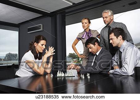 Stock Photography - Business team playing chess. Fotosearch