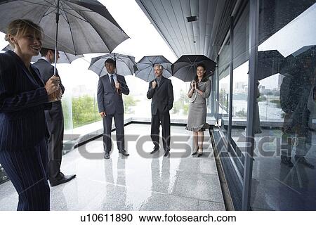 Business team with umbrellas View Large Photo Image Stock Image - Business team with umbrellas. Fotosearch
