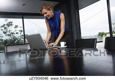 Stock Photograph - Business woman at work. Fotosearch