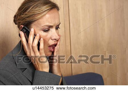 Stock Photography - Business woman making a call. Fotosearch