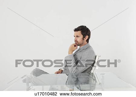 Businessman against white background View Large Photo Image Stock Image - Businessman against white background. Fotosearch