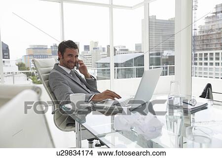 Picture - Businessman at work. Fotosearch