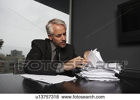 Stock Photo - Businessman at work. Fotosearch