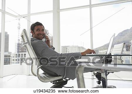 Stock Photography - Businessman at work. Fotosearch