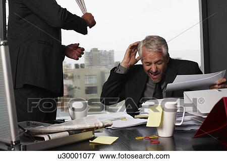Businessman being beaten View Large Photo Image Stock Photo - Businessman being beaten. Fotosearch