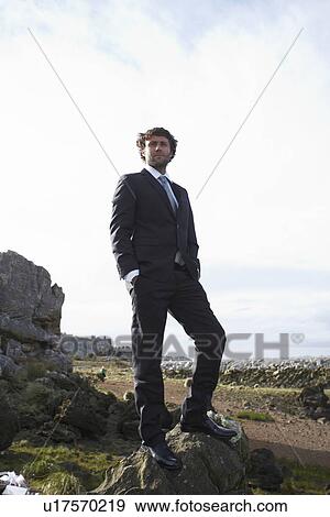 Stock Photo - Businessman in the countryside. Fotosearch