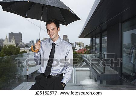 Stock Photo - Businessman in the rain. Fotosearch