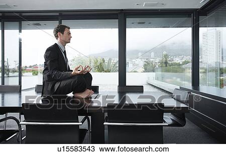 Businessman meditating View Large Photo Image Stock Image - Businessman meditating. Fotosearch