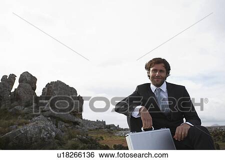 Stock Photograph - Businessman on the Rocks. Fotosearch