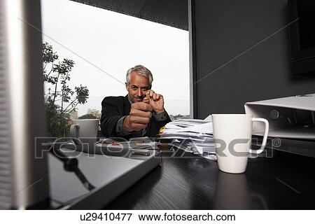 Stock Photo - Businessman playing. Fotosearch