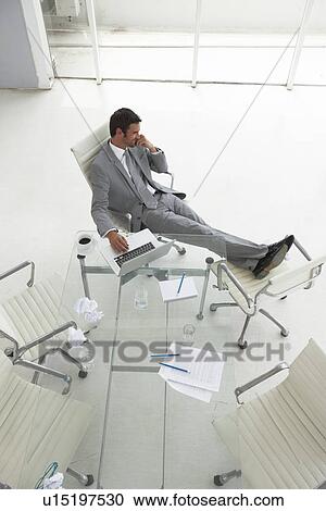 Businessman relaxing View Large Photo Image Stock Image - Businessman relaxing. Fotosearch