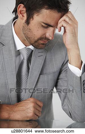 Picture - Businessman thinking. Fotosearch