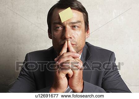 Stock Photo - Businessman thinking. Fotosearch