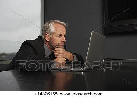 Stock Photography - Businessman thinking. Fotosearch
