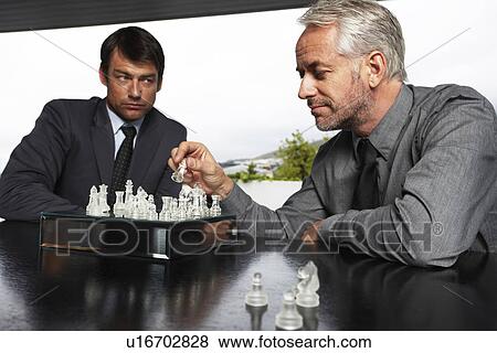 Stock Photo - Businessmen competing. Fotosearch