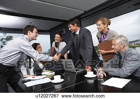 Stock Photo - Businessmen shaking hands. Fotosearch