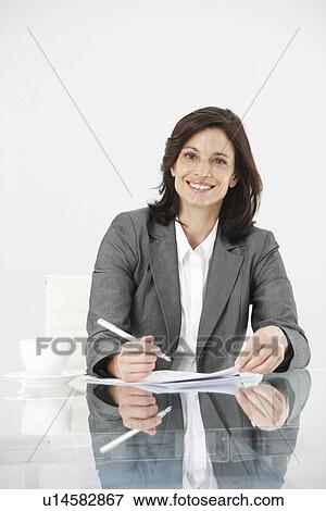 Businesswoman at work View Large Photo Image Stock Photo - Businesswoman at work. Fotosearch