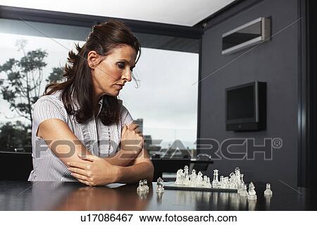 Businesswoman playing chess View Large Photo Image Stock Photo - Businesswoman playing chess. Fotosearch