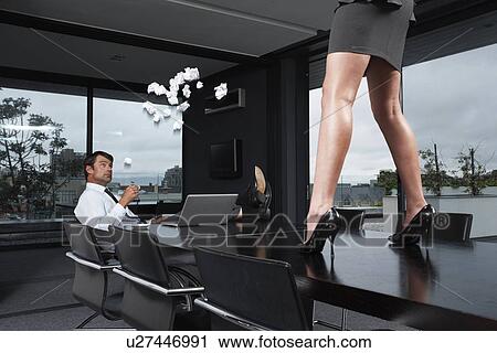 Businesswoman throwing trash at man View Large Photo Image Stock Image - Businesswoman throwing trash at man. Fotosearch