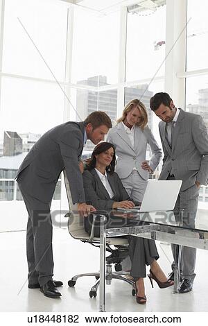 Businesswoman with her team View Large Photo Image Stock Image - Businesswoman with her team. Fotosearch