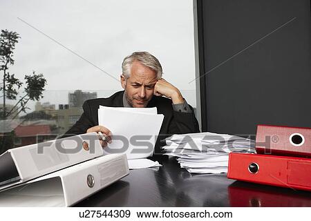 Stock Photo - Busy businessman. Fotosearch