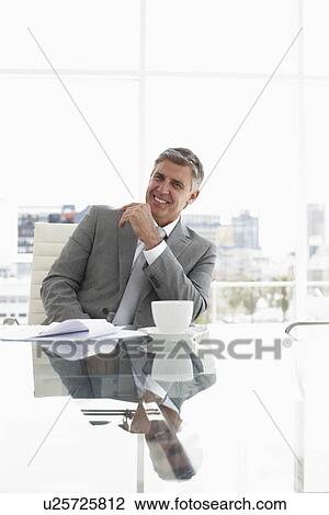 Stock Image - Ceo in his office. Fotosearch