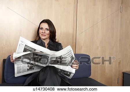CEO reading a newspaper View Large Photo Image Stock Photo - CEO reading a newspaper. Fotosearch