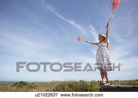 Stock Photo - Child playing outdoors. Fotosearch