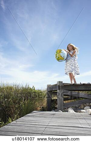 Stock Photo - Child with a globe. Fotosearch