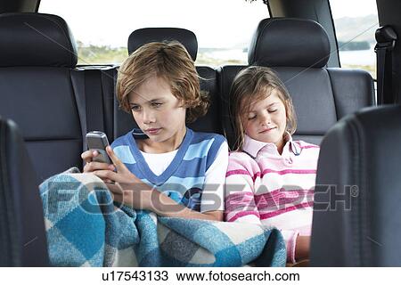 Children in the back of the car View Large Photo Image Stock Image - Children in the back of the car. Fotosearch