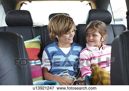 Stock Photo - Children listening to music. Fotosearch