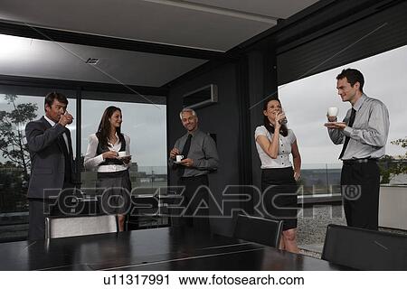Stock Image - Colleagues having a break. Fotosearch