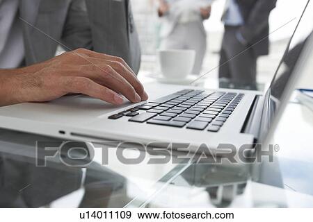 Computer and hand close up View Large Photo Image Stock Photo - Computer and hand close up. Fotosearch