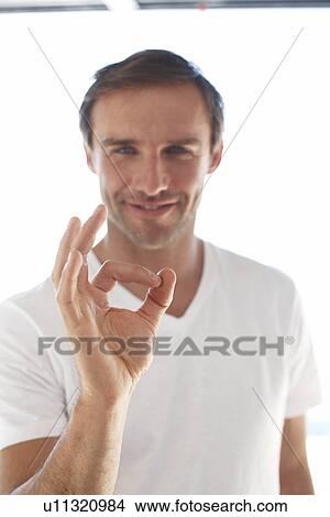 Picture - Confident young man. Fotosearch