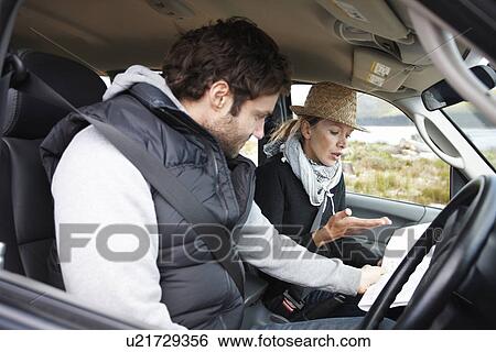 Stock Photograph - Couple arguing in their car. Fotosearch