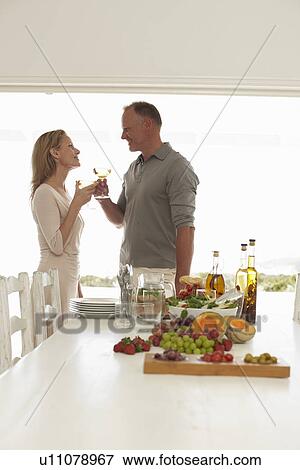 Couple having a drink View Large Photo Image Stock Photo - Couple having a drink. Fotosearch