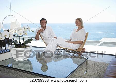 Couple in a luxurious villa View Large Photo Image Stock Image - Couple in a luxurious villa. Fotosearch