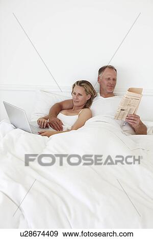 Couple in their bedroom View Large Photo Image Stock Photo - Couple in their bedroom. Fotosearch