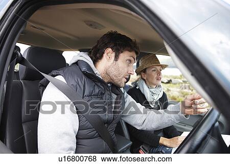 Stock Photo - Couple in their car. Fotosearch