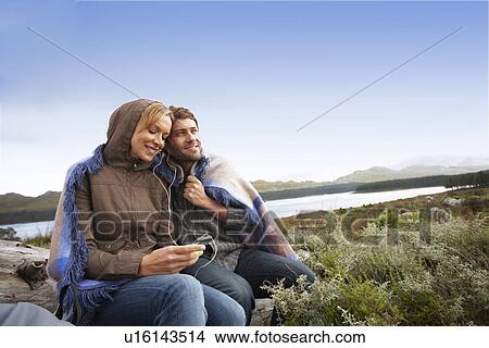 Picture - Couple listening to music. Fotosearch