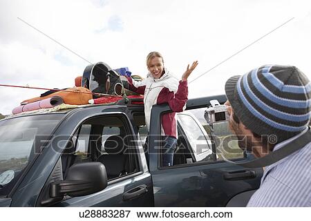 Couple on a road trip View Large Photo Image Stock Photo - Couple on a road trip. Fotosearch