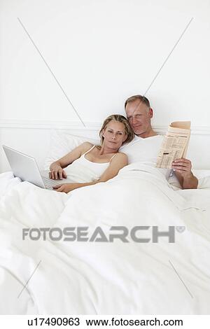 Stock Image - Couple relaxing. Fotosearch