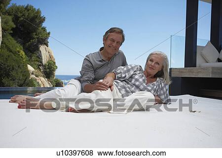 Stock Photo - Couple relaxing. Fotosearch