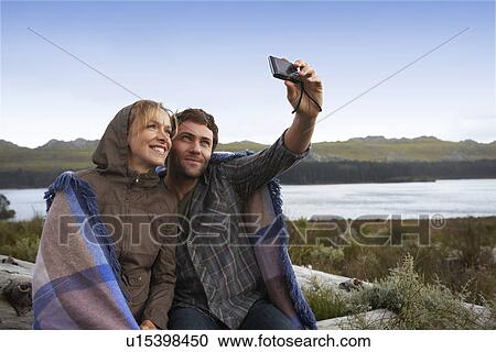 Couple taking picture of themselves View Large Photo Image Stock Image - Couple taking picture of themselves. Fotosearch