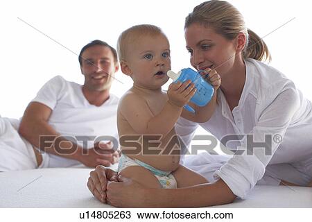 Cute baby with his parents View Large Photo Image Stock Image - Cute baby with his parents. Fotosearch