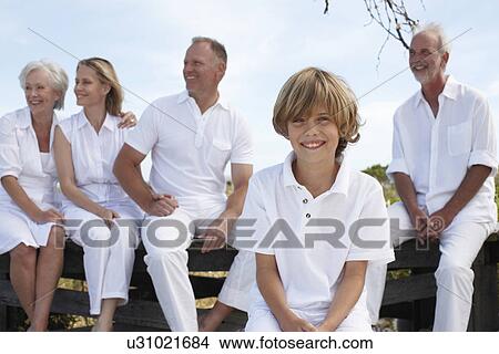 Cute boy with his family View Large Photo Image Picture - Cute boy with his family. Fotosearch