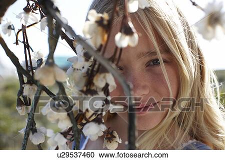 Stock Image - Cute girl looking to the camera. Fotosearch