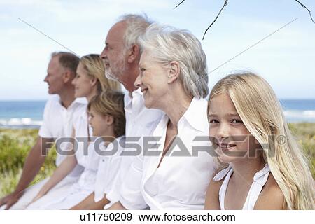 Cute girl with her family View Large Photo Image Stock Photo - Cute girl with her family. Fotosearch
