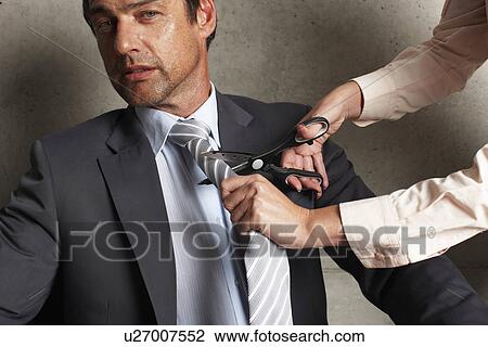 Cutting a tie View Large Photo Image Stock Image - Cutting a tie. Fotosearch