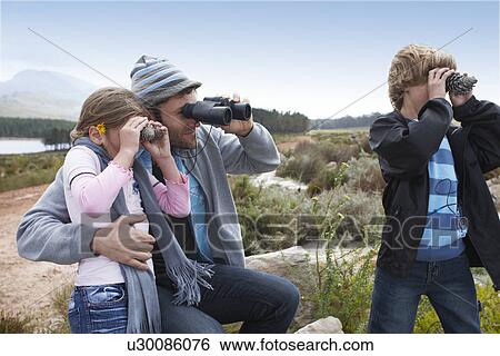 Stock Photograph - Dad with his children. Fotosearch